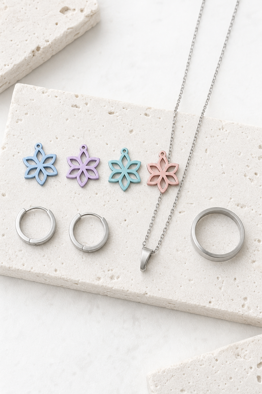 SUIJI set — bright matte titanium on pale travertine (AI placeholder)