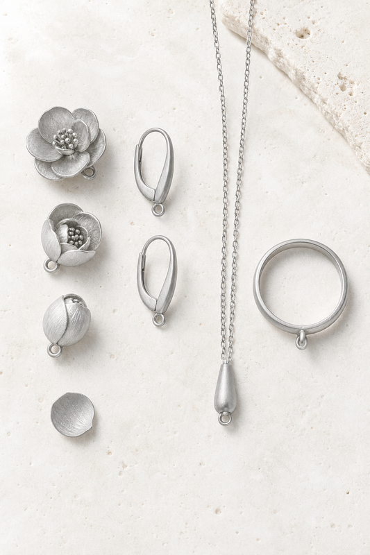 SUIJI set — bright matte titanium on pale travertine (AI placeholder)
